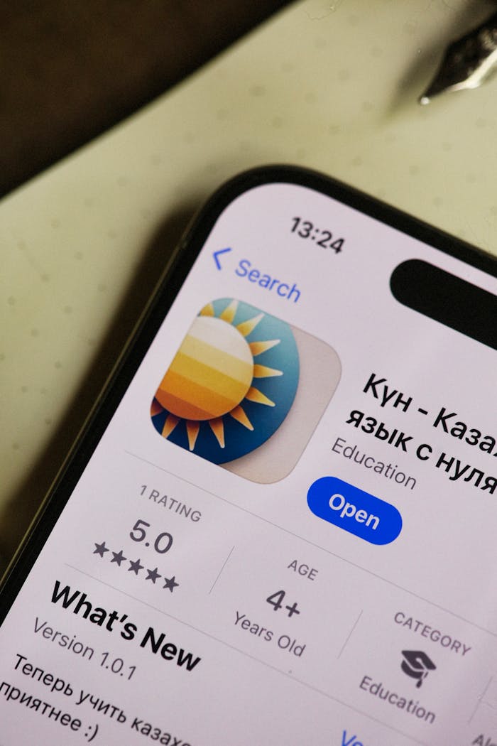 Close-up of smartphone with an educational app on display, showcasing user interface.